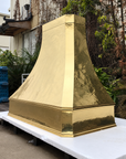 Unlacquered brass range hood cover by Brasslik