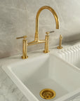 Vintara Unlacquered Brass Bridge Kitchen Faucet with Side Sprayer