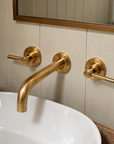 Al Ula wall-mounted unlacquered brass faucet for modern and traditional sinks