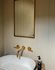 Solid unlacquered brass wall-mounted bathroom faucet, Al Ula by Brasslik