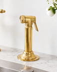 Unlacquered brass side sprayer for kitchen faucet with focused spray