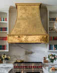 Classic custom brass range hood for luxury kitchens