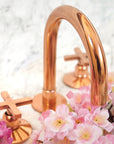 Brass bathroom faucet with copper finish, deck mount design