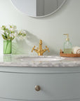 Solid brass bath vanity faucet that develops a natural patina
