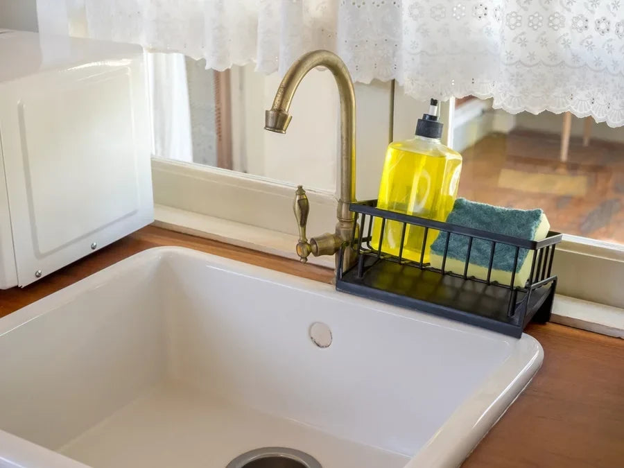 Unlacquered brass faucet in kitchen sink