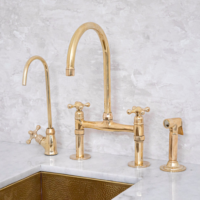Unlacquered brass bridge kitchen faucet with cross handles