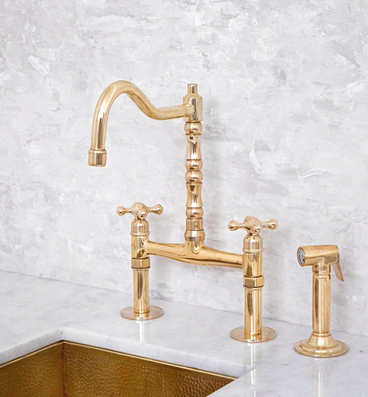 Unlacquered brass bridge kitchen faucet
