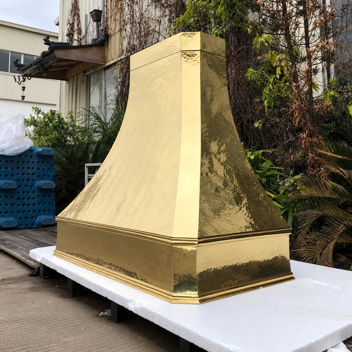Unlacquered brass range hood cover by Brasslik