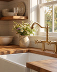 Unlacquered brass bridge faucet for farmhouse sinks