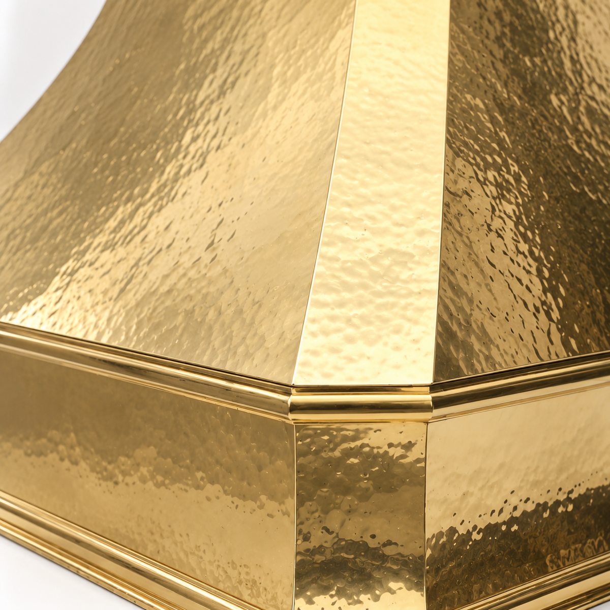 Handcrafted brass range hood cover for ventilation inserts