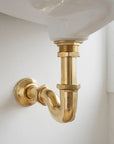 Unlacquered brass push up sink drain without overflow that ages to a natural patina