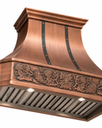 Copper range hood cover with warm antique patina