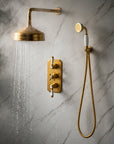 Nebraska thermostatic shower set in unlacquered brass with porcelain handles