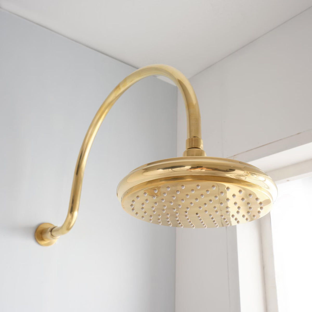 Al Sultan unlacquered brass rain shower for a clean, reliable shower setup