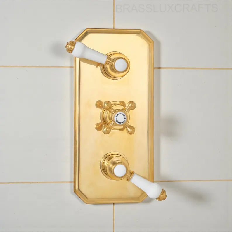Thermostatic unlacquered brass shower system with natural patina finish