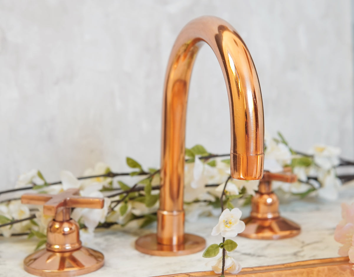 Deck mounted gooseneck bathroom faucet in copper finish