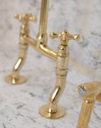 Curved leg brass bridge kitchen faucet with traditional design
