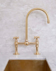 Dusty unlacquered brass bridge faucet with optional cold water tap
