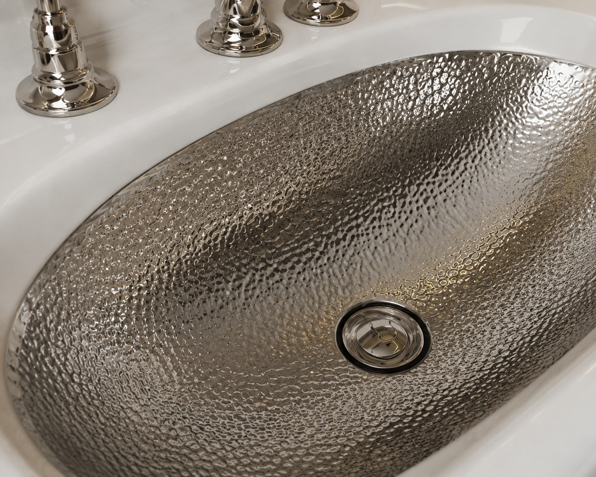 Handcrafted hammered nickel oval vessel sink by Brasslik
