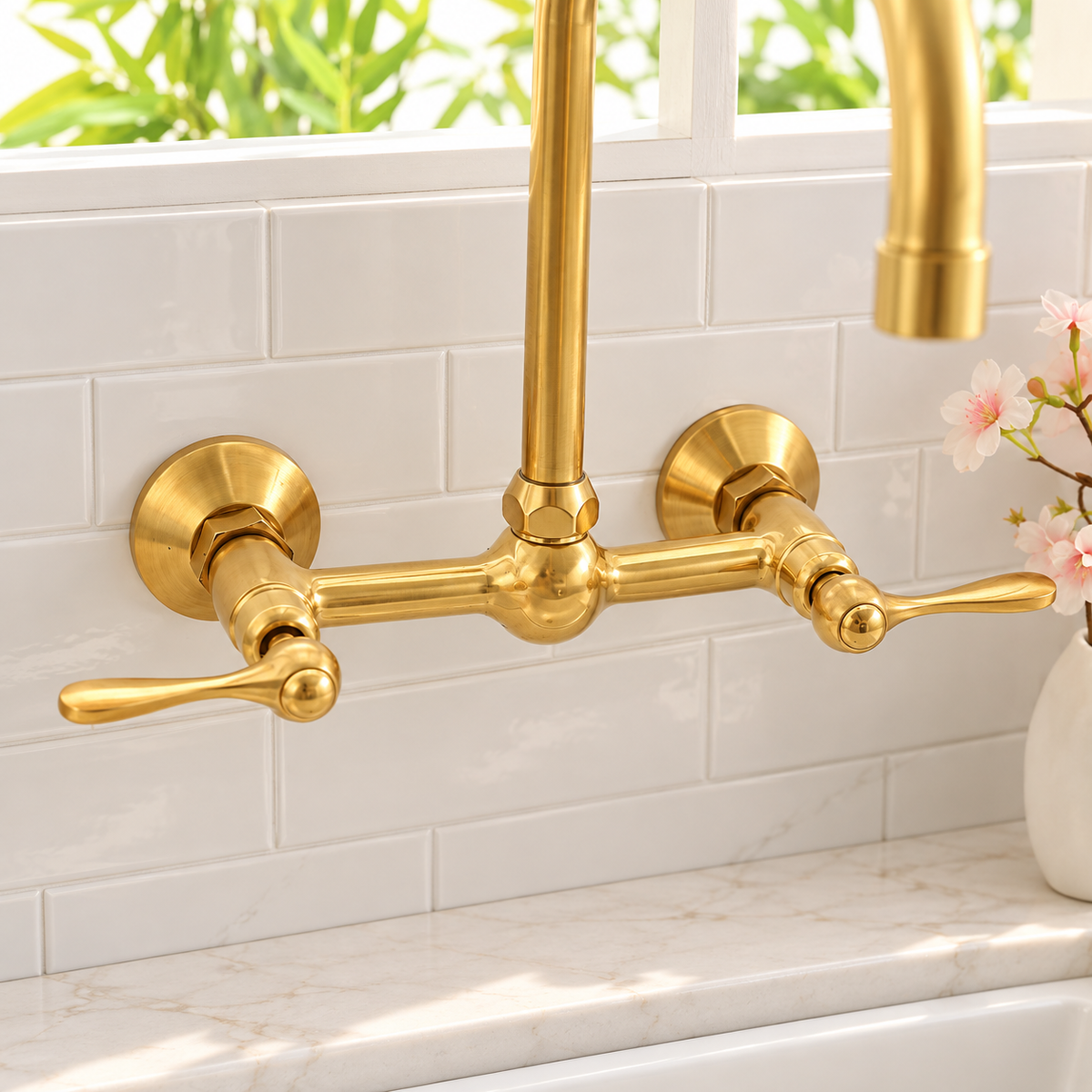 Huntley wall mounted faucet in natural unlacquered brass