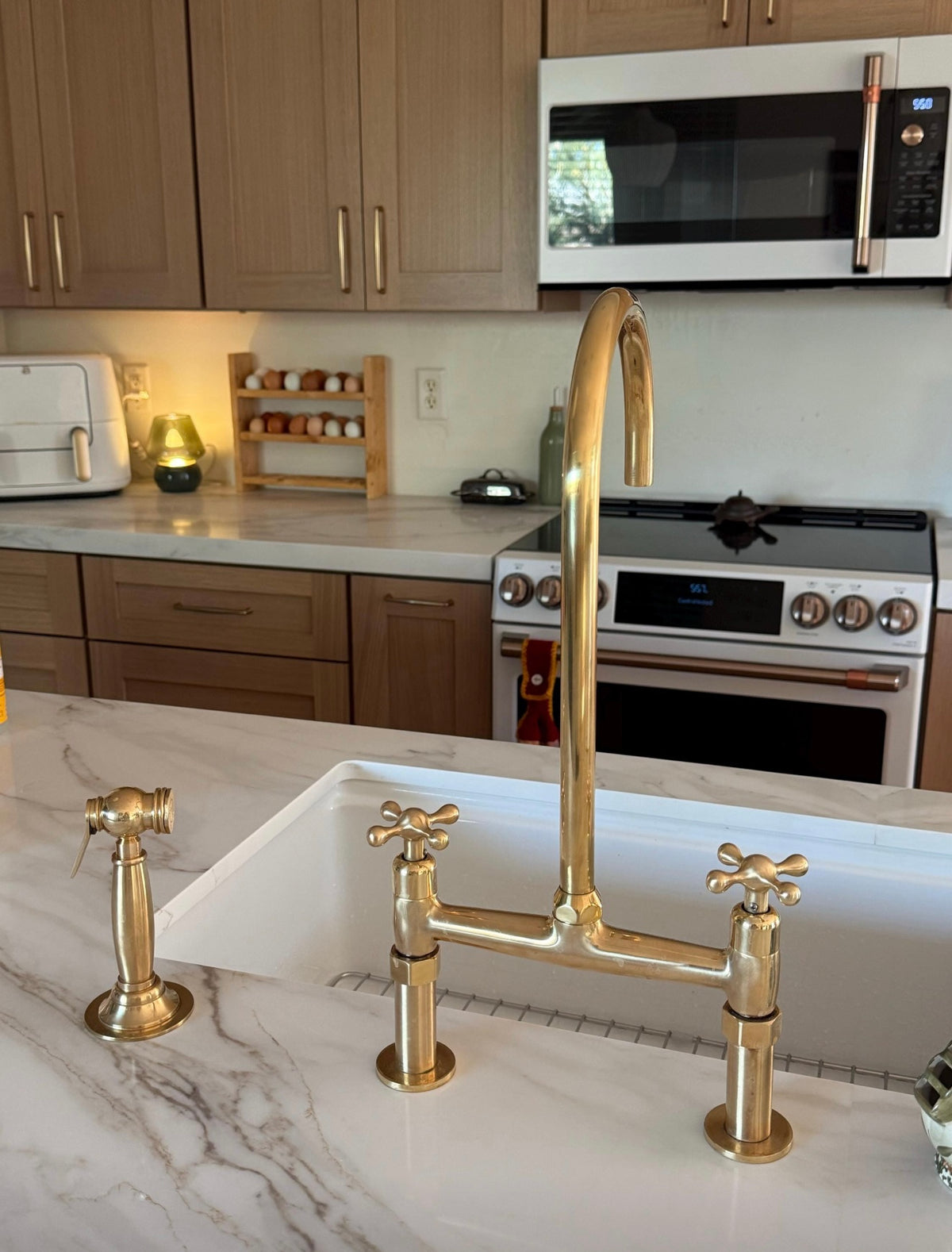 King Size unlacquered brass kitchen faucet detail