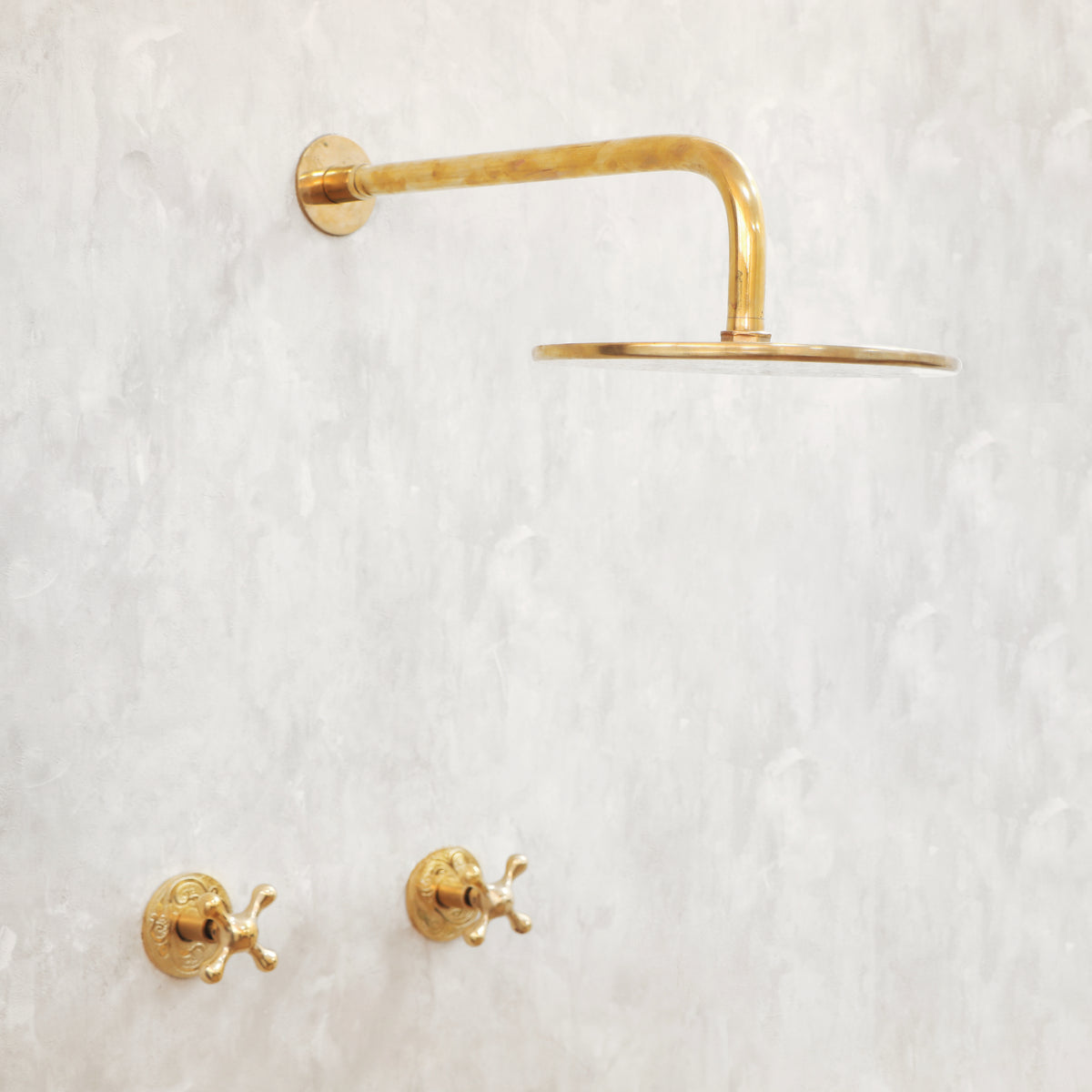 Mykonos style unlacquered brass shower system with rainfall shower and hand shower