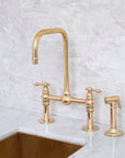 Seven unlacquered brass bridge kitchen faucet