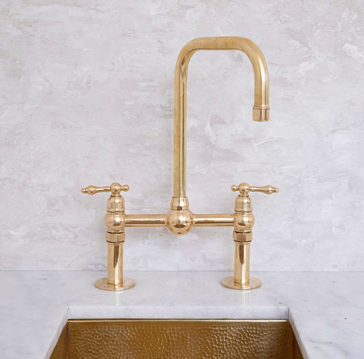Seven bridge faucet in unlacquered brass by Brasslik