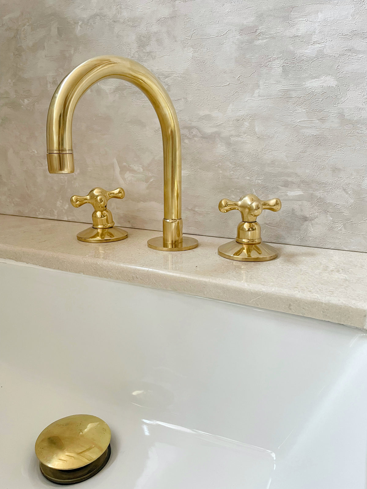 Unlacquered brass deck mount faucet, 3-hole design by Brasslik