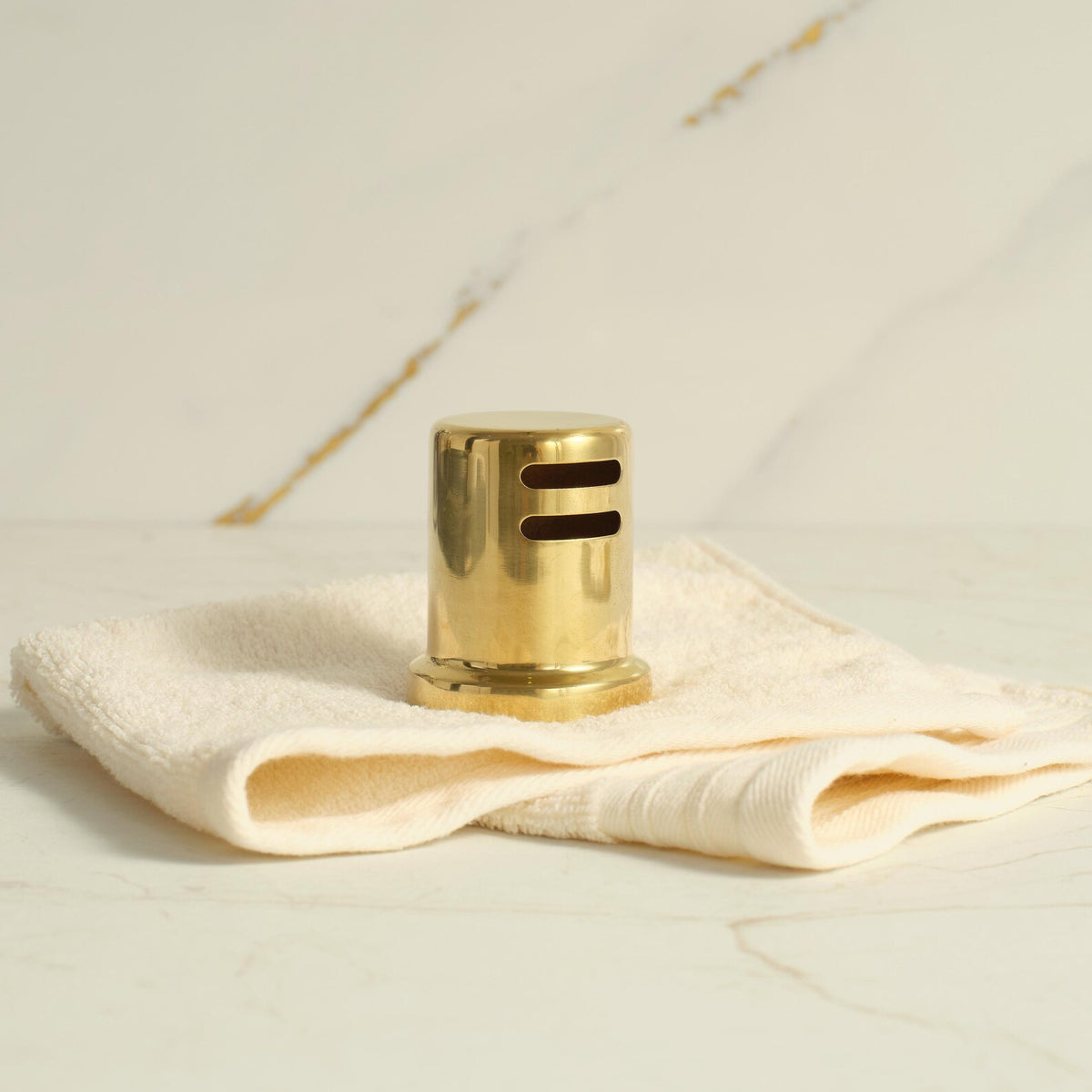 Unlacquered brass sink air gap cover that develops a patina