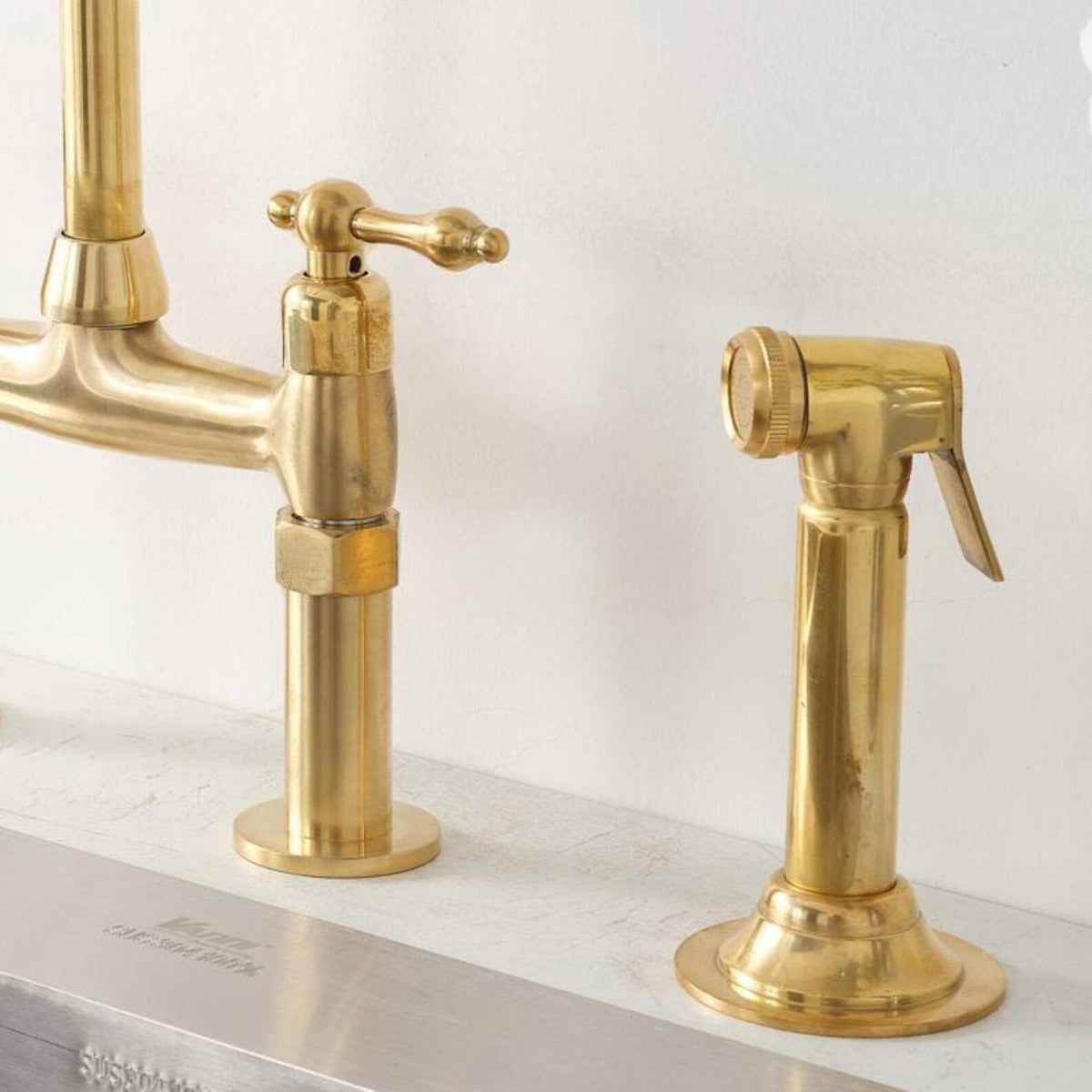 Handcrafted unlacquered brass bridge faucet with side sprayer