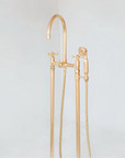 Solid brass freestanding tub filler for bathtubs