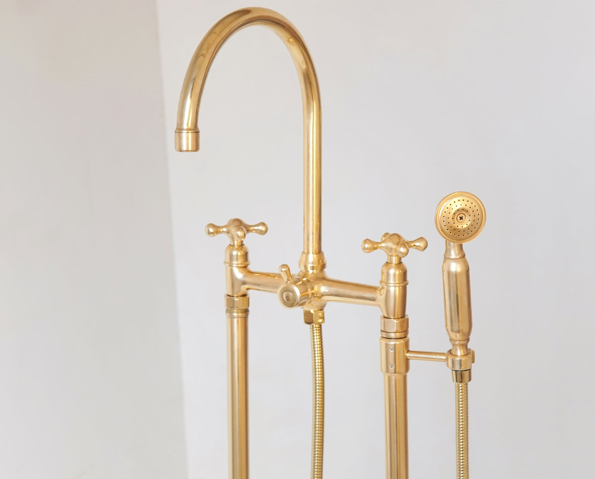 Unlacquered brass freestanding tub faucet that develops a natural patina