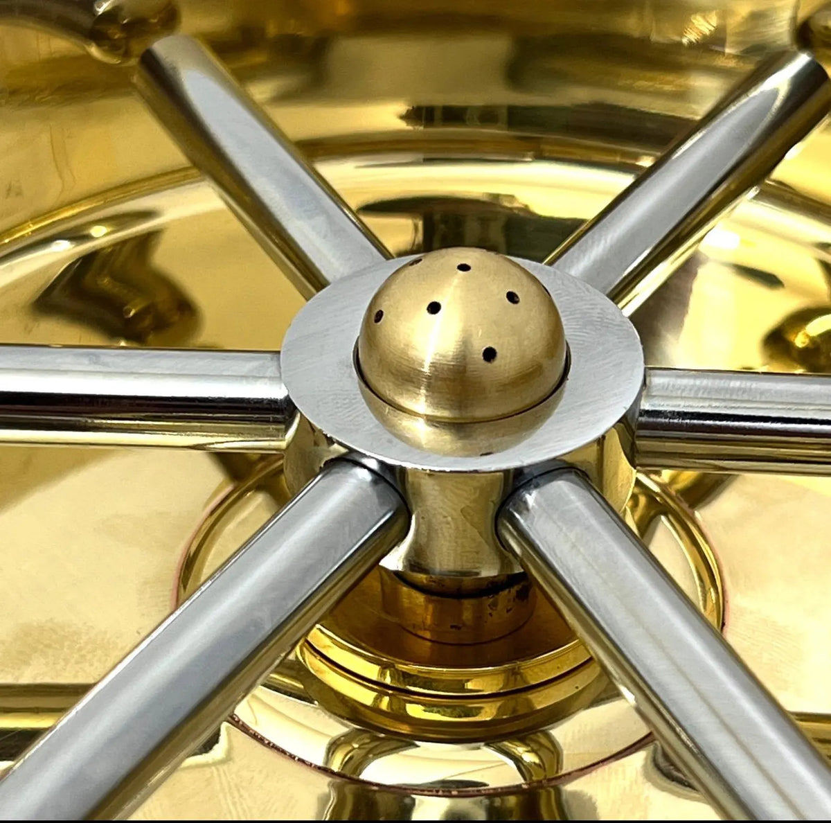 Unlacquered brass glass rinser that develops a natural patina