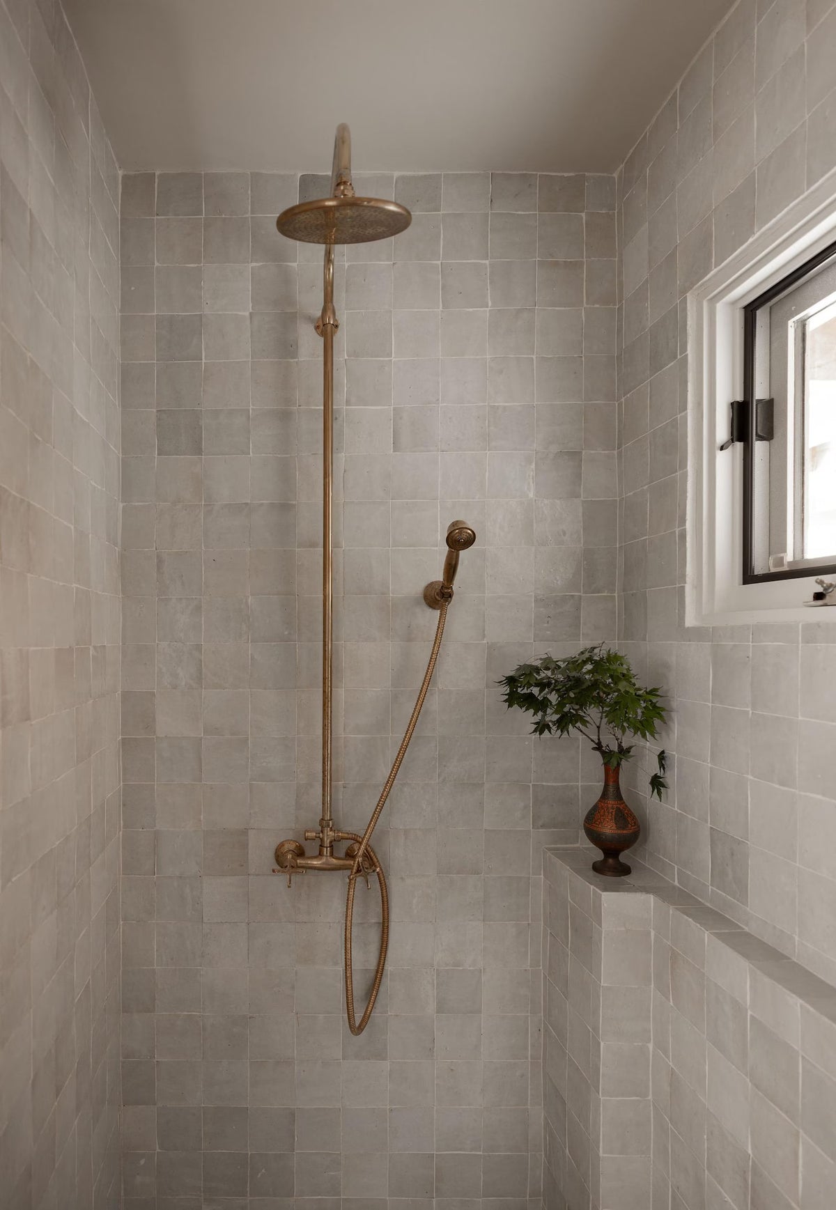 Unlacquered brass shower for indoor and outdoor use