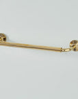 Wall mounted unlacquered brass bathroom towel rail