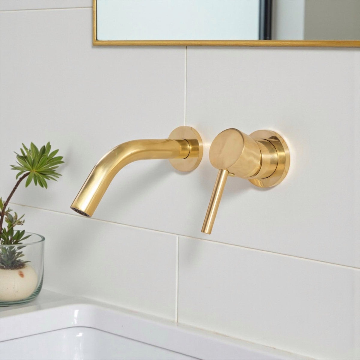 Unlacquered brass wall mount faucet with single handle for hot and cold water