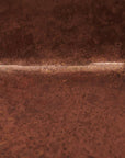 Unlacquered copper bar sink with natural patina