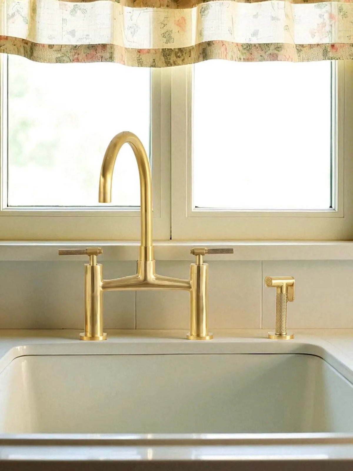 Vintara brass bridge kitchen faucet with side sprayer