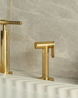 Vintara bridge kitchen faucet with side sprayer, unlacquered brass