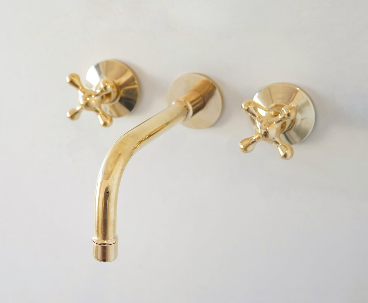 Handcrafted unlacquered brass wall-mount faucet