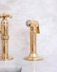 Westminster kitchen bridge faucet in natural brass finish